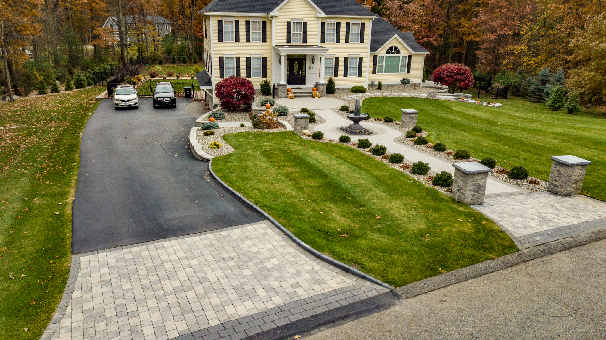 Custom driveway with paver apron and pillars. 