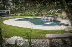 Pool patio with deck jets and water falls