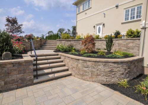 Techo Bloc Retaining wall around patio with steps
