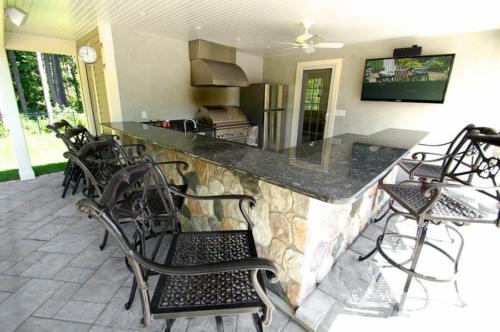 Outdoor Kitchen with Bar and Seating