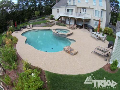 Exposed Aggregate Pool Deck with Stone Diving Board